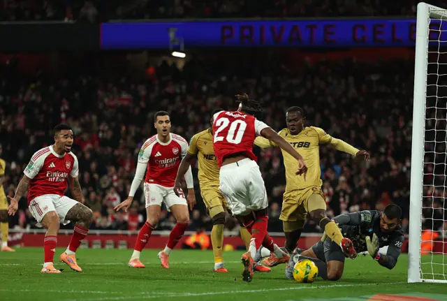 Walter Benitez gets down low to deny Noni Madueke from close range