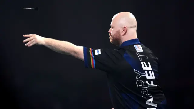 Justin Hood throws a dart