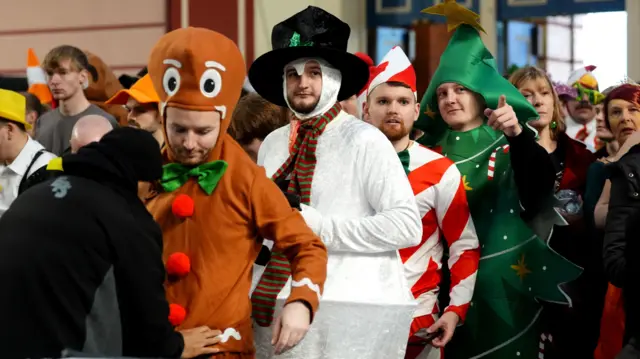 Darts fans in fancy dress