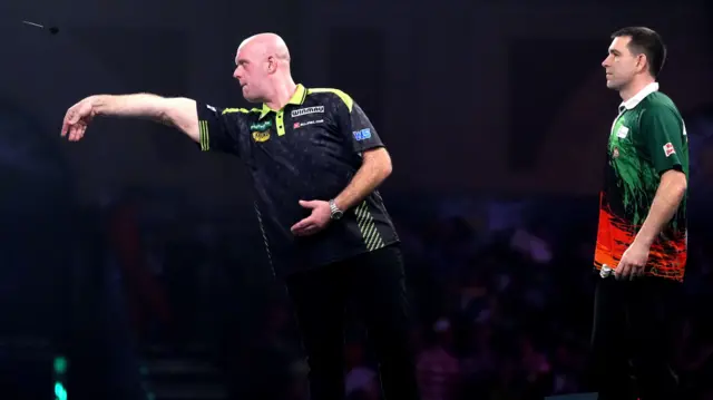 Michael van Gerwen throws a dart