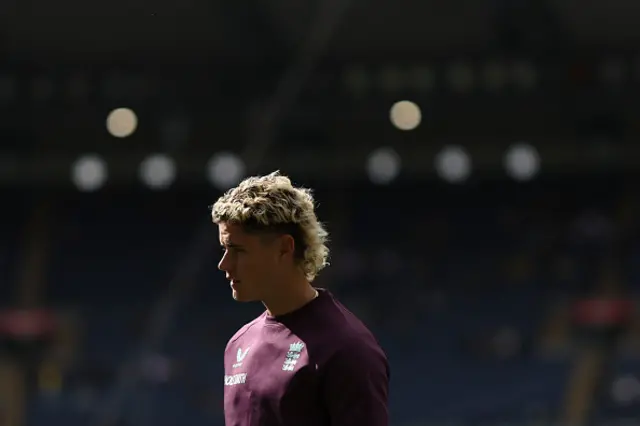 England's Jacob Bethell warms up ahead of play