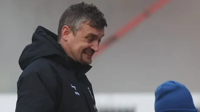 A smiling Michael Skubala
