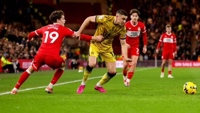 Blackburn's Lewis Miller tries to dribble past Sverre Nypan