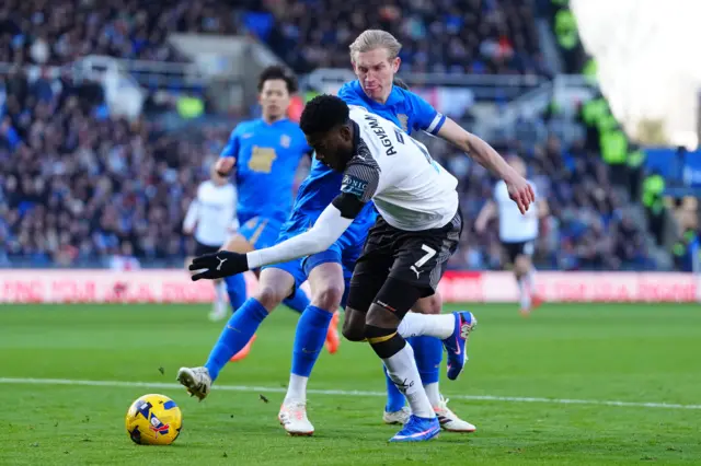 Derby's Patrick Agyemang takes on Birmingham captain Christoph Klarer
