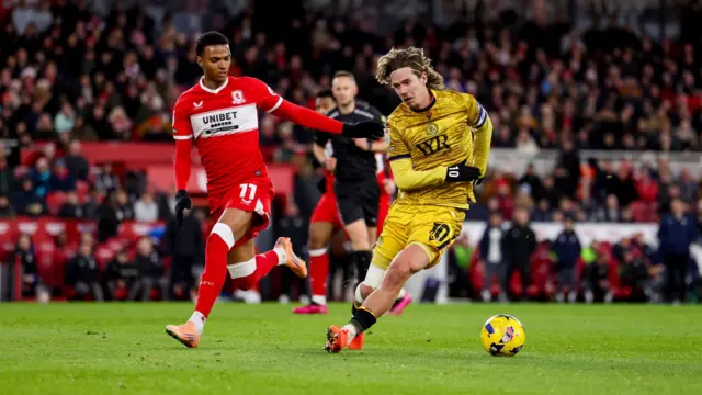 Todd Cantwell tries to dribble past Middlesbrough's Morgan Whittaker
