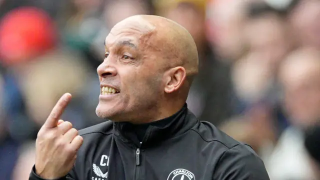 Charlton assistant boss Curtis Fleming gesticulating from the touchline.