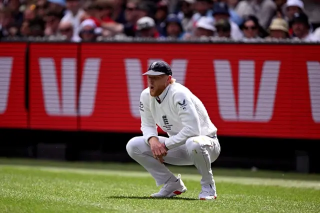 England's Ben Stokes reacts after attempting to stop a boundary