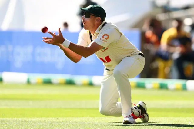 Scott Boland of Australia takes a caught to dismiss Brydon Carse