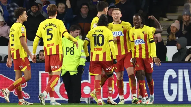 Watford players celebrate with goalscorer Mattie Pollock