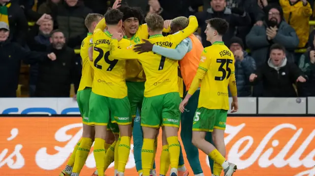 Norwich players celebrate with Jovon Makama