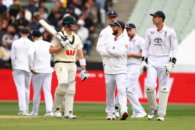 Steve Smith of Australia speaks with Ben Duckett