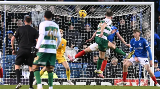 Jimmy Dunne heads QPR's equaliser at Portsmouth