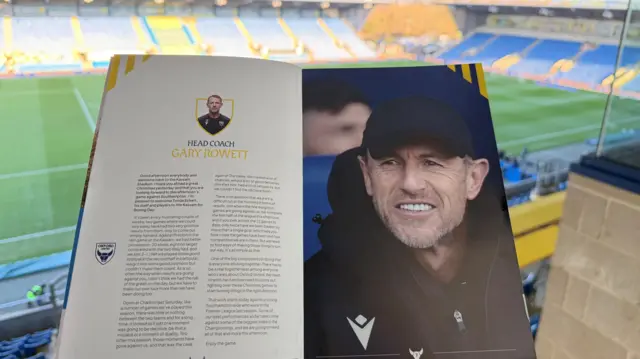 A photo of an Oxford United programme at the Kassam Stadium