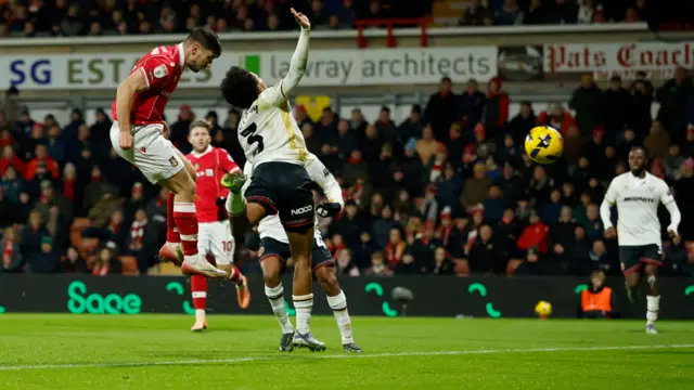 Ryan Longman heads Wrexham's equaliser against Sheffield United