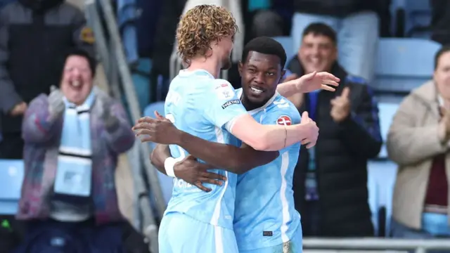 Jack Rudoni hugs goalscorer Ephron Mason-Clark