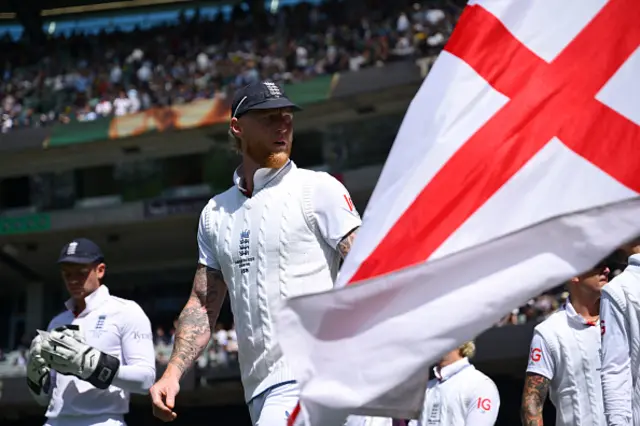 Ben Stokes of England leads his team out