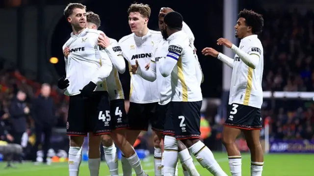 Sheffield United players celebrate with Patrick Bamford