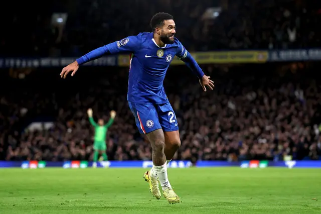 Reece James of Chelsea celebrates his team's first goal, scored by teammate Joao Pedro