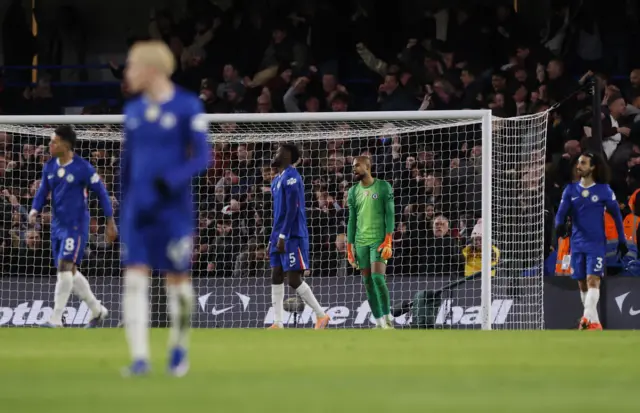 Chelsea's Robert Sanchez and Chelsea's Benoit Badiashile react after Aston Villa's Ollie Watkins scored their first goal