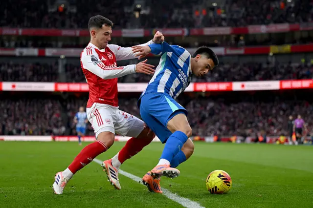 Diego Gomez of Brighton & Hove Albion is challenged by Martin Zubimendi
