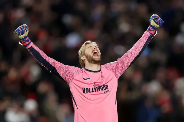 Caoimhin Kelleher of Brentford celebrates after teammate Kevin Schade (not pictured) scored