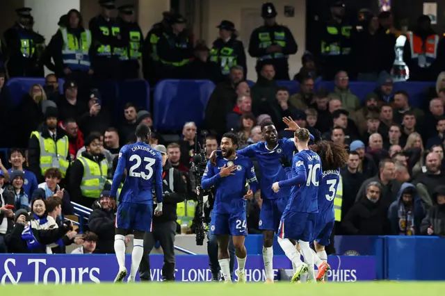 Reece James of Chelsea celebrates his team's first goal, scored by teammate Joao Pedro
