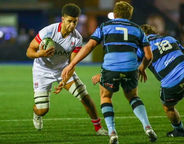 Cormac Izuchukwu carries the ball against Cardiff