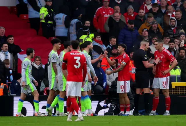 Manchester City's Ruben Dias clashes with Nottingham Forest's Morgan Gibbs-White as Nottingham Forest's Nikola Milenkovic remonstrates with referee Robert Jones