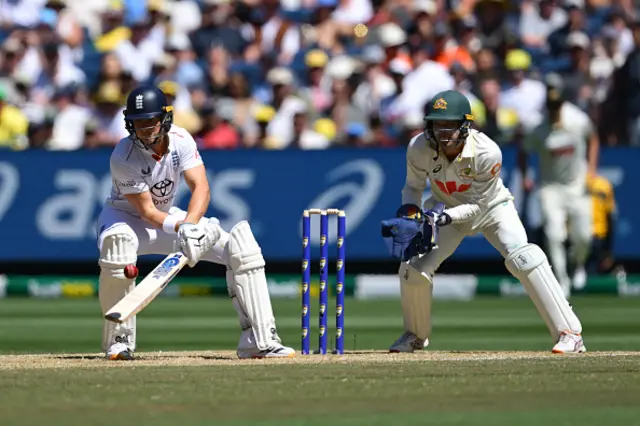 Jacob Bethell of England plays a shot