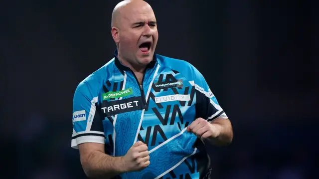 Rob Cross celebrates