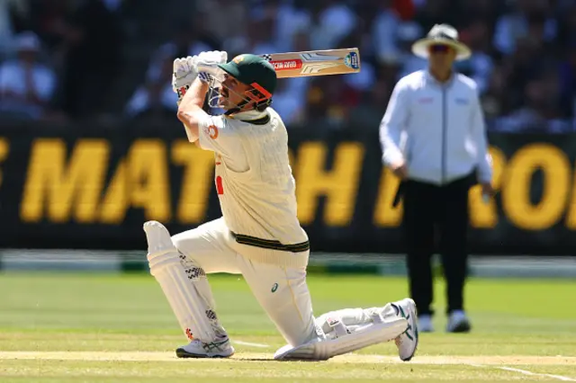 Travis Head of Australia plays a shot