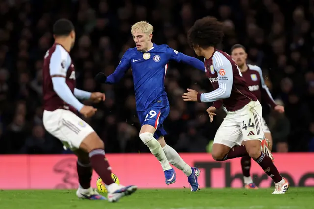 Alejandro Garnacho of Chelsea runs with the ball whilst under pressure from Boubacar Kamara of Aston Villa