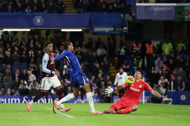 Joao Pedro of Chelsea has his shot saved by Emiliano Martinez of Aston Villa during the Premier League match between Chelsea and Aston Villa at Stamford Bridge on December 27, 2025 in London, England.