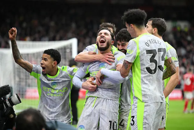 Rayan Cherki of Manchester City celebrates with teammates