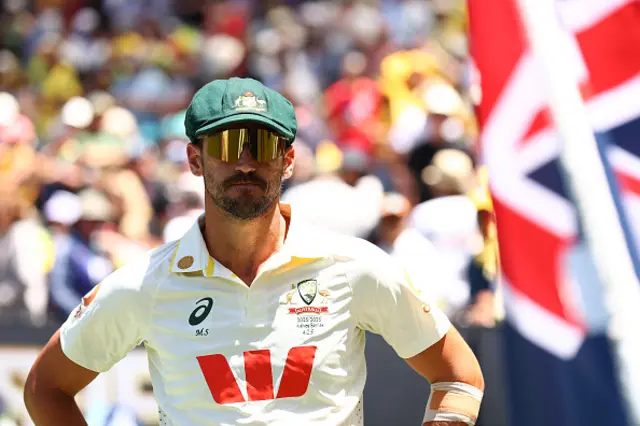 Mitchell Starc of Australia looks on