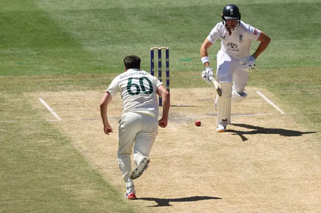 England's Jacob Bethell (R) runs between the wickets