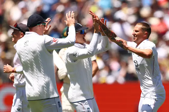 Brydon Carse of England celebrates the wicket of Michael Neser