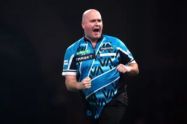 England's Rob Cross reacts during his match against Australia's Damon Heta on day fifteen of the Paddy Power World Darts Championship at the Alexandra Palace, London