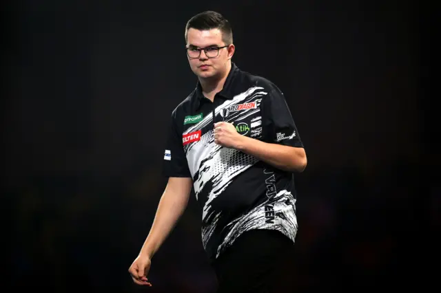 Netherlands' Gian van Veen reacts during his match against Latvia's Madars Razma on day fifteen of the Paddy Power World Darts Championship at the Alexandra Palace, London