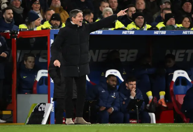 Glasner points and shout instructions from the dugout