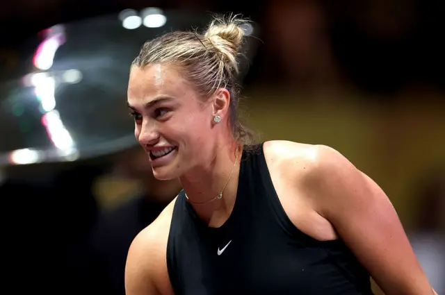 Aryna Sabalenka looks on