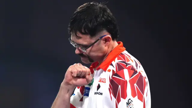 Australia's Damon Heta reacts during his match against England's Rob Cross on day fifteen of the Paddy Power World Darts Championship at the Alexandra Palace, London