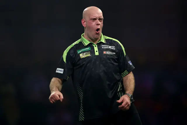 Michael van Gerwen celebrates winning the second set
