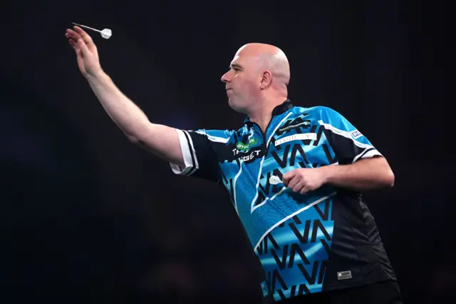 England's Rob Cross during his match against Australia's Damon Heta on day fifteen of the Paddy Power World Darts Championship at the Alexandra Palace, London