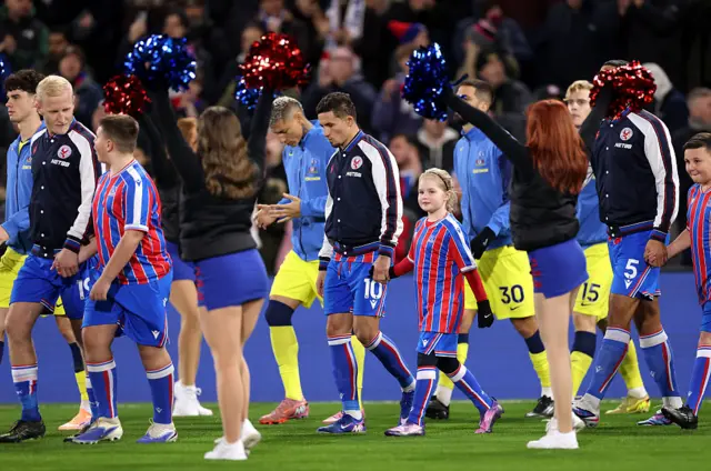 Pino walks out with a mascot