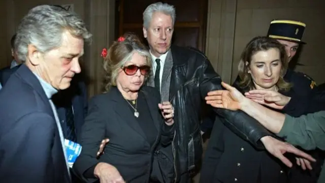 Brigitte Bardot leaves a Parisian courtroom in May 2004 after her appearance on charges of inciting racial hatred