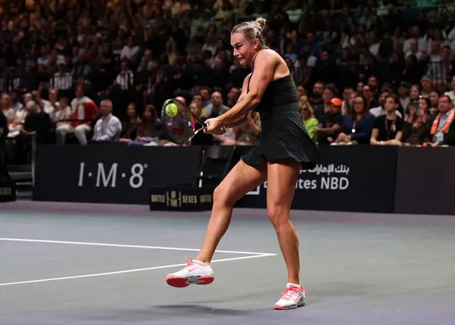 Aryna Sabalenka plays a backhand