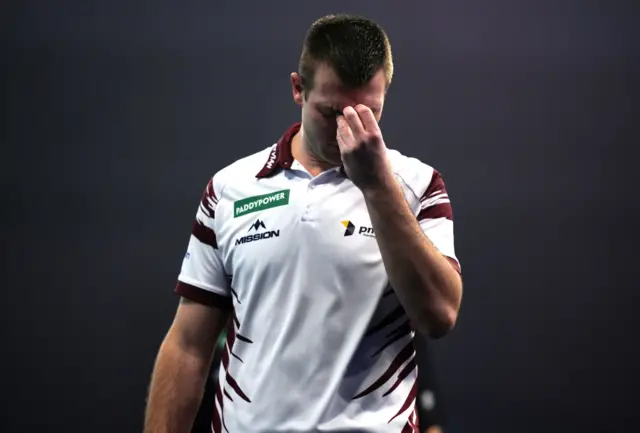 Latvia's Madars Razma reacts during his match against Netherland's Gian van Veen on day fifteen of the Paddy Power World Darts Championship at the Alexandra Palace, London