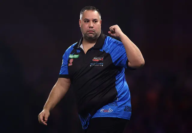 Jermaine Wattimena celebrates winning the second set against Gary Anderson