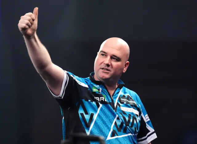 England's Rob Cross celebrates defeating Australia's Damon Heta on day fifteen of the Paddy Power World Darts Championship at the Alexandra Palace, London